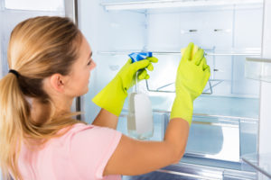 Woman Cleaning Fridge